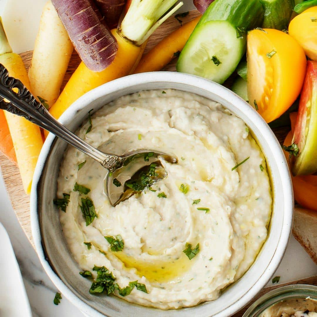 White bean dip in a bowl with vegetables