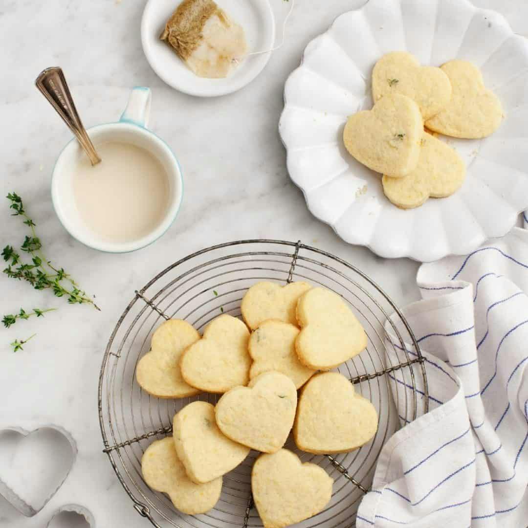Heart-shaped lemon shortbread cookies on a cooking rack