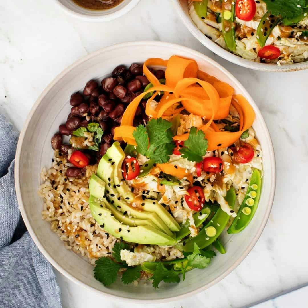 Brown rice bowl with adzuki beans, avocado, and sesame slaw