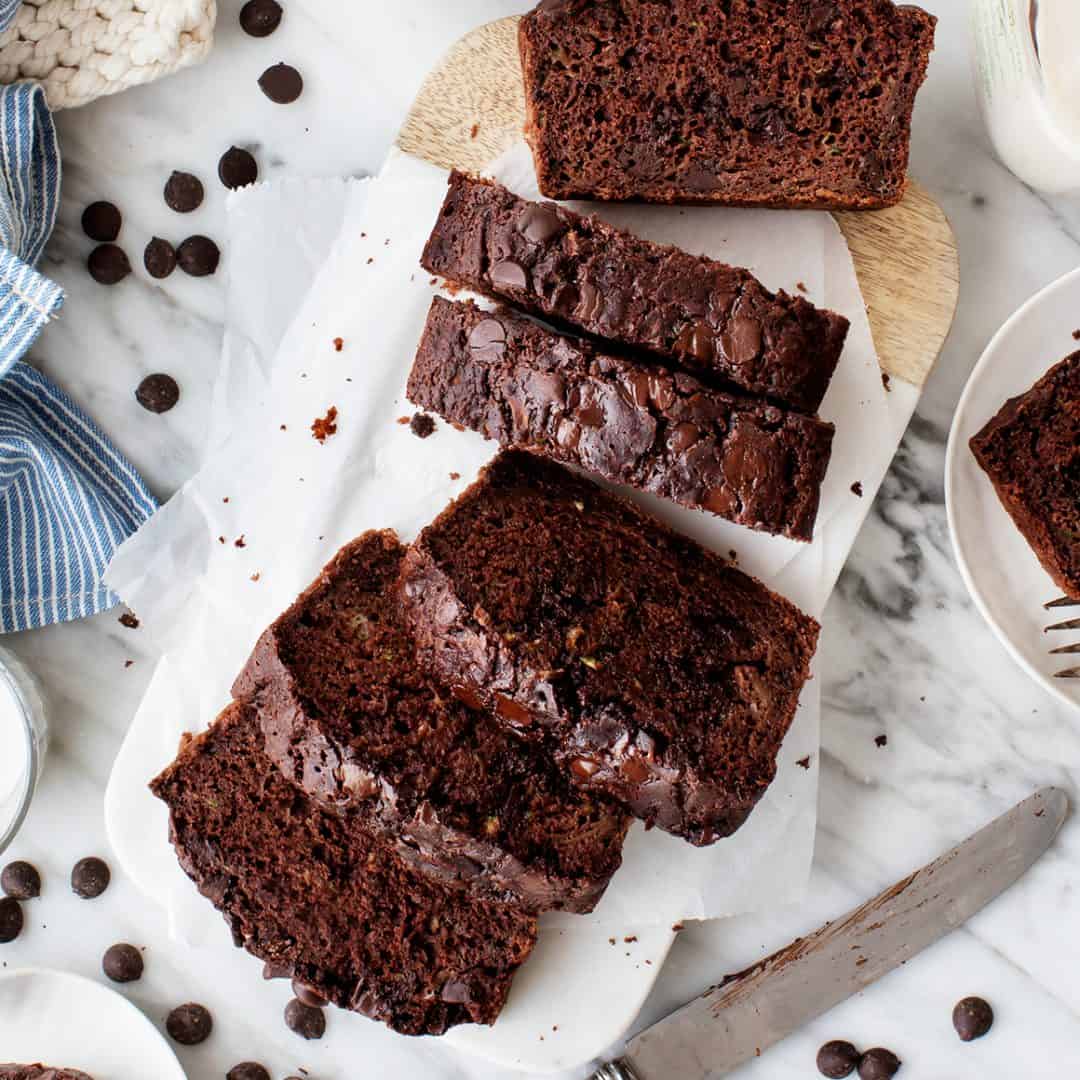 Sliced chocolate zucchini bread on cutting board