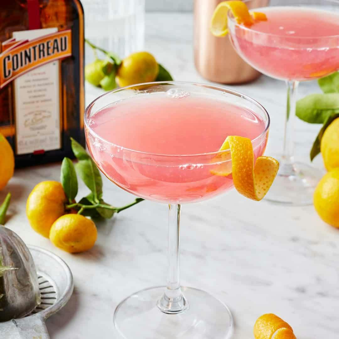 Cosmopolitan cocktail garnished with an orange twist