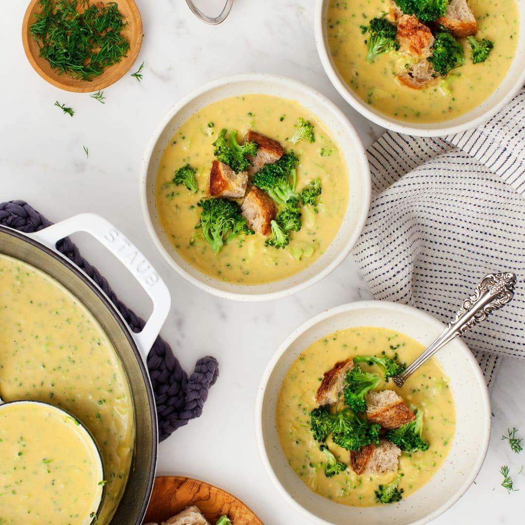 Three bowls of vegan broccoli soup