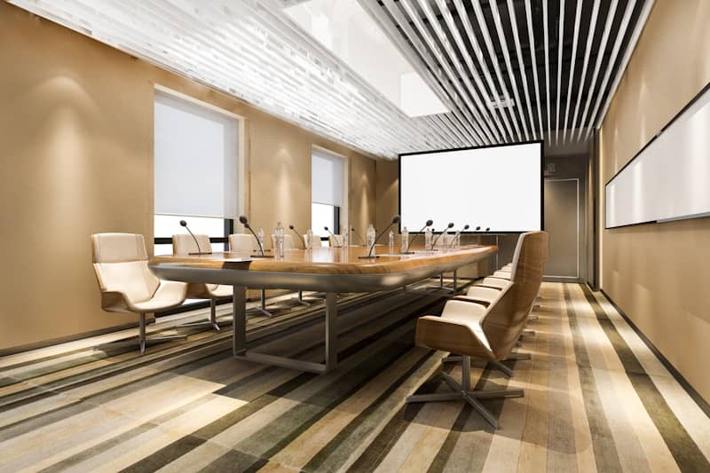 Modern conference room with long table and chairs