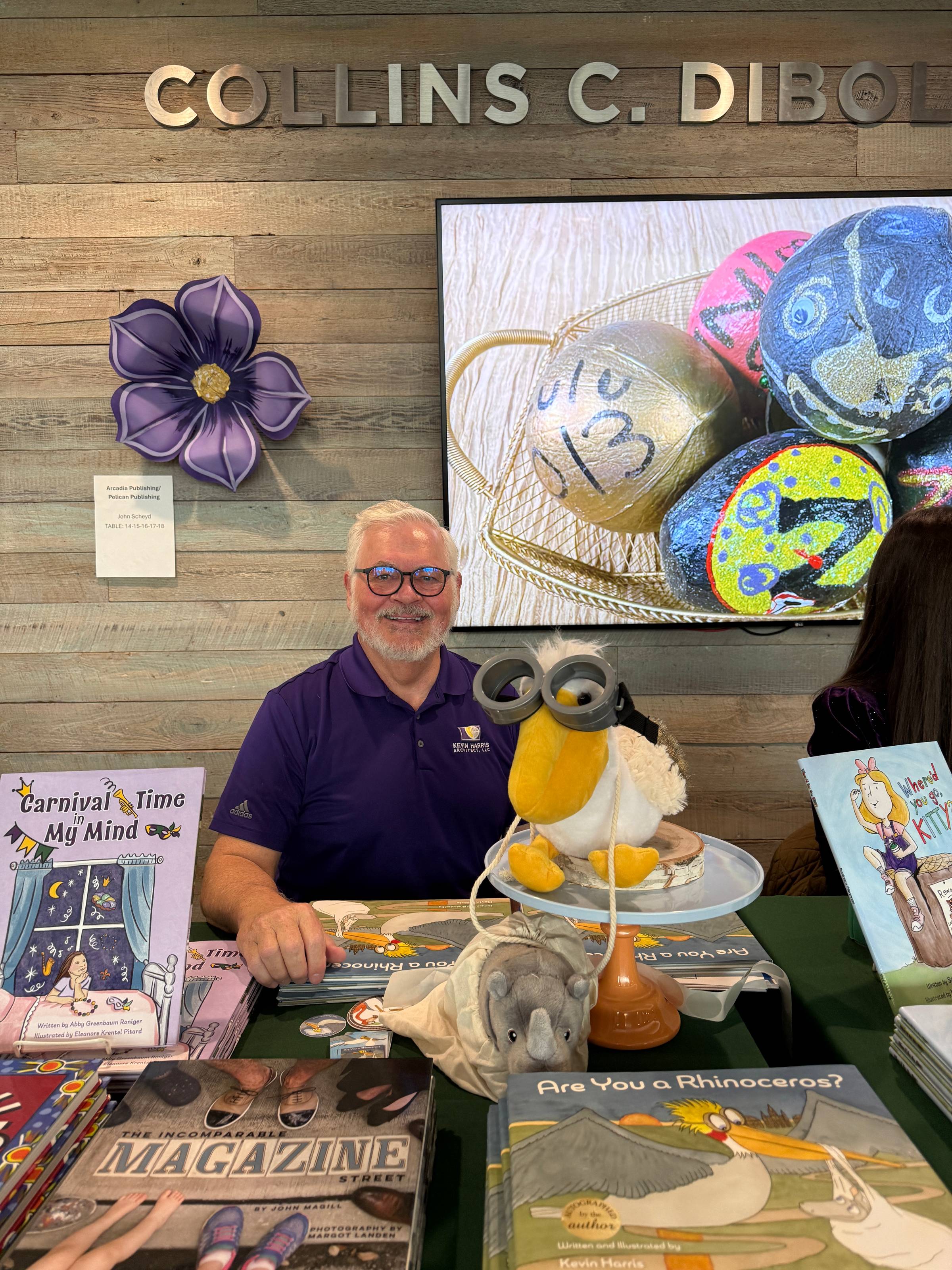 Kevin Harris signing copies of Are You a Rhinoceros at the WYES King Cake and Conversation event