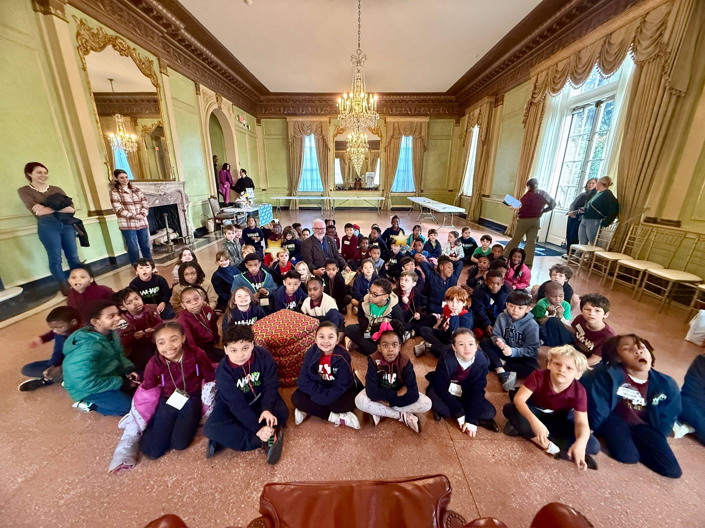 Kevin reading to children at the Old Governor's Mansion