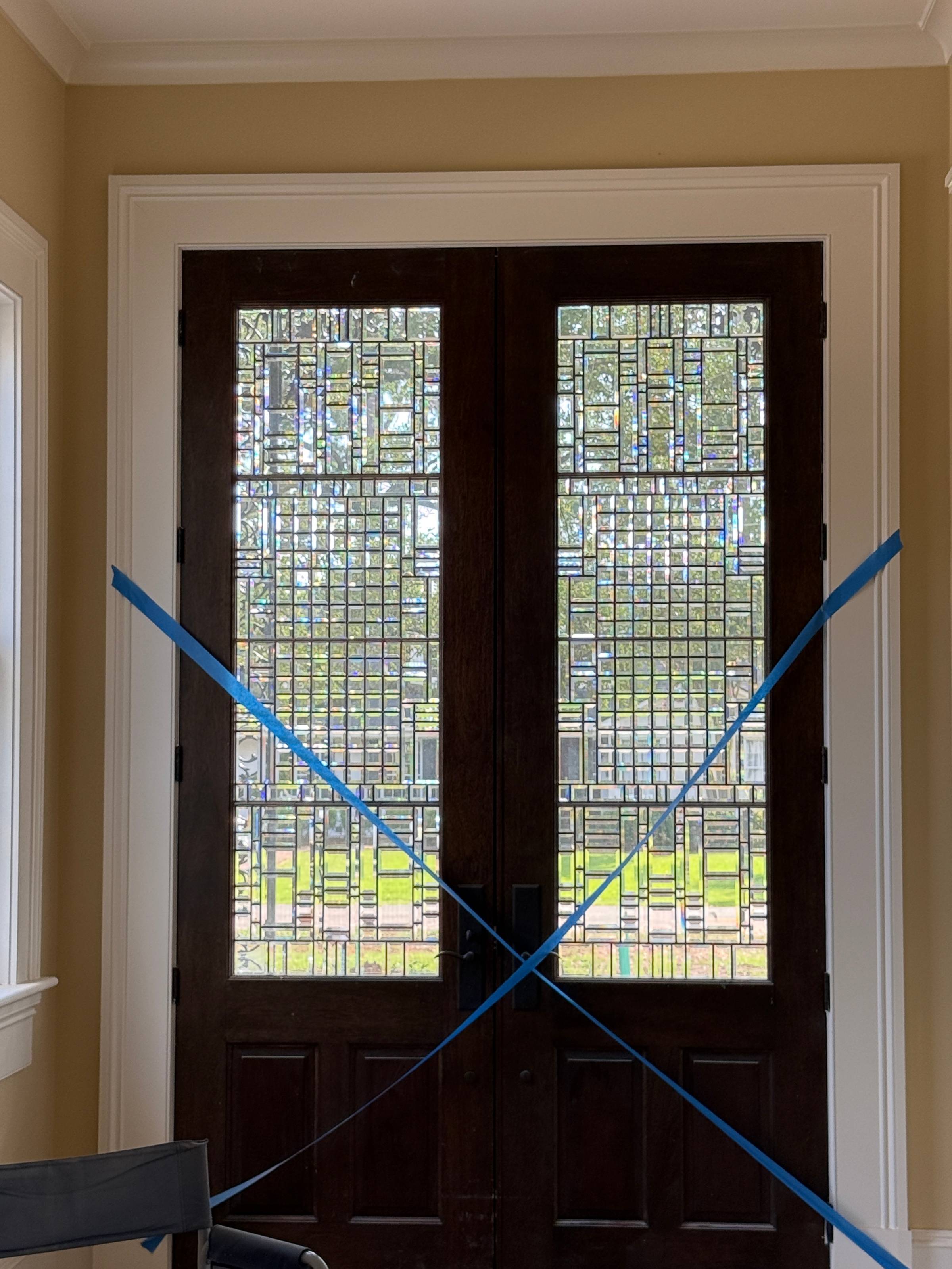 Leaded bevel glass double door with an intricate geometric pane pattern, newly installed at a Victorian Greek Revival residence in West Monroe, Louisiana