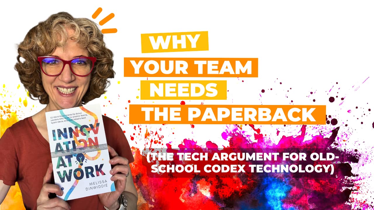 Melissa Dinwiddie smiling and holding up a copy of Innovation at Work, with bold orange and white text reading "Why Your Team Needs the Paperback (The Tech Argument for Old-School Codex Technology)" against a vibrant paint-splatter background in red, pink