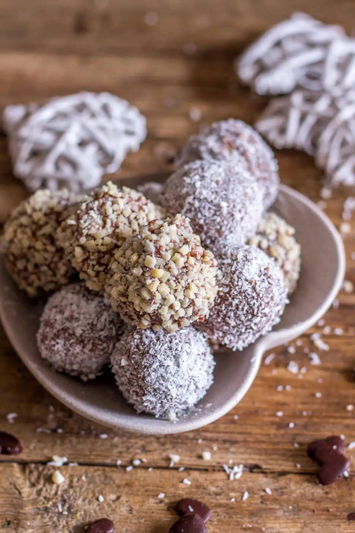 Cookie truffles on a white plate.
