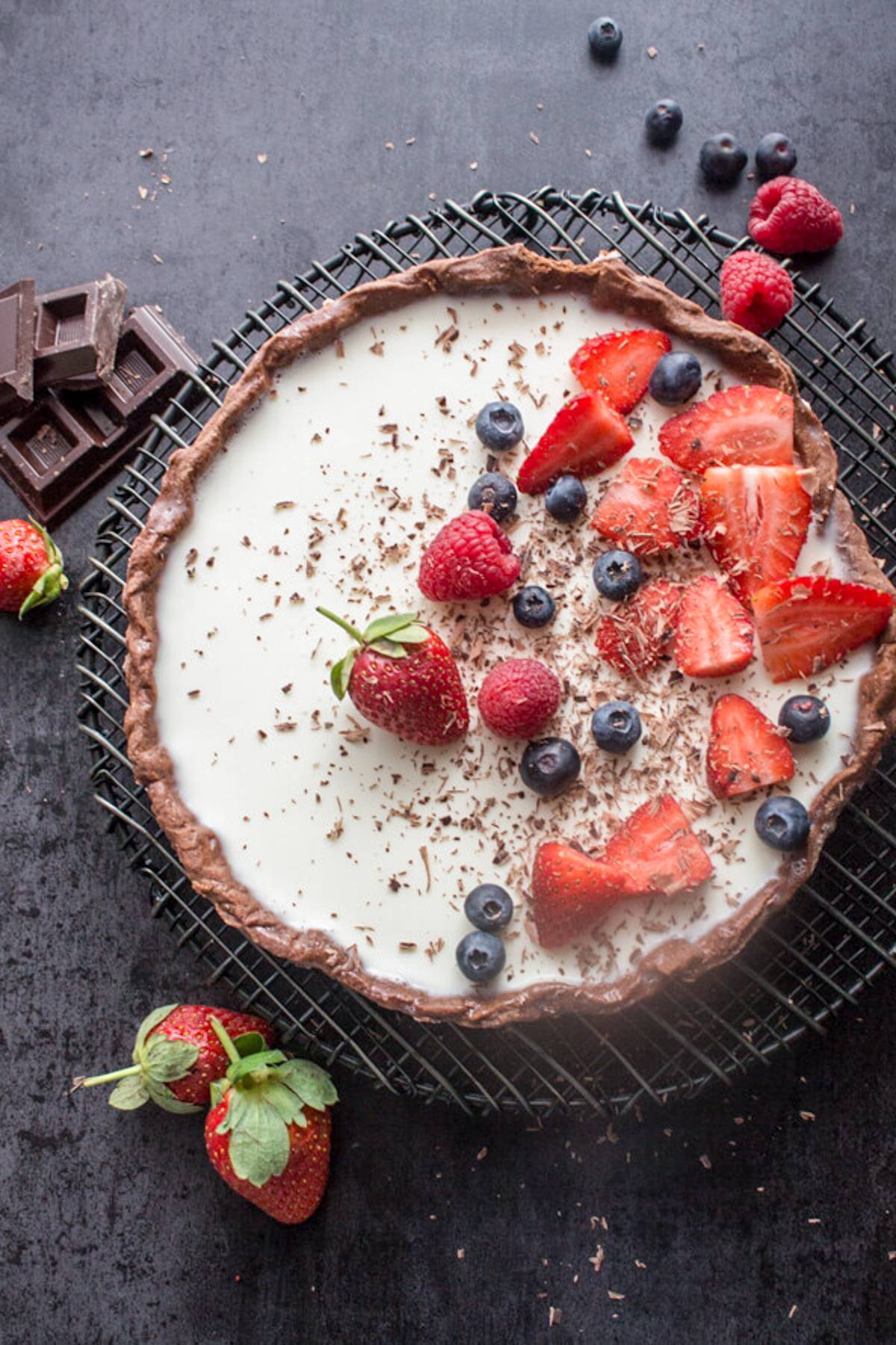 Panna cotta tart on a wire rack.