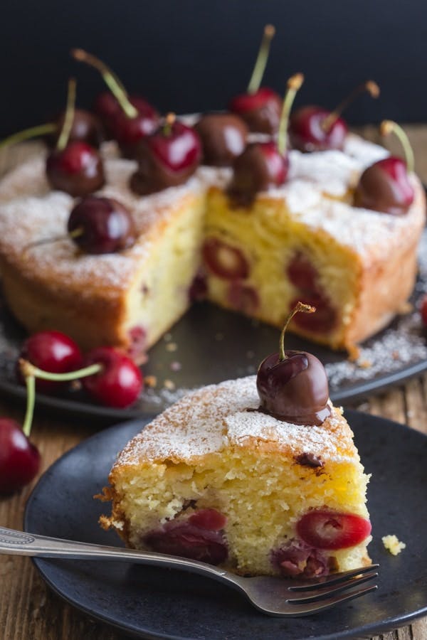 Fresh Cherry cake with a slice cut.