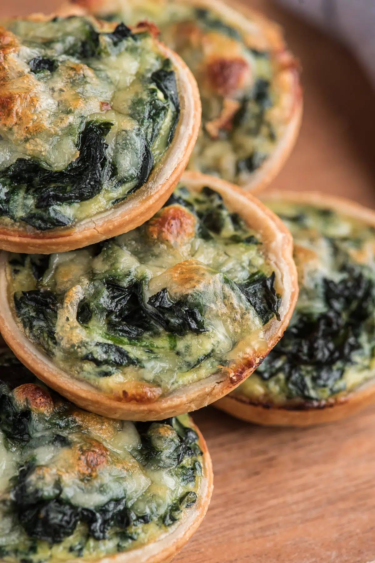 Ricotta spinach tarts stacked.