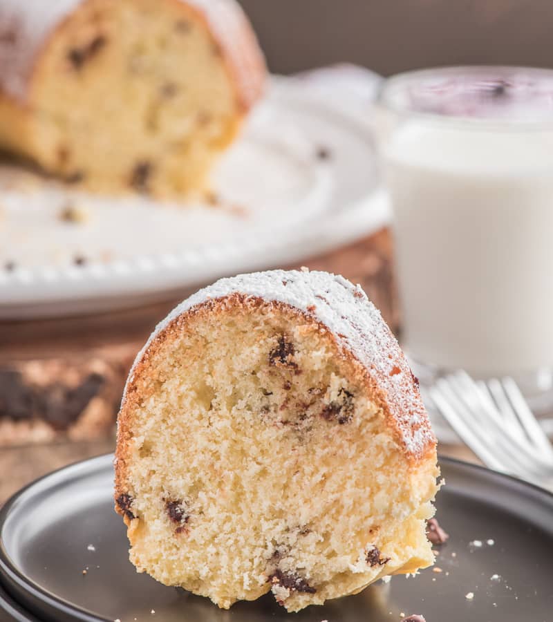 Italian chocolate chip cake with a slice on a white plate.