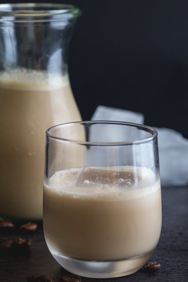 Italian creamy coffee liqueur in a bottle and in a glass.