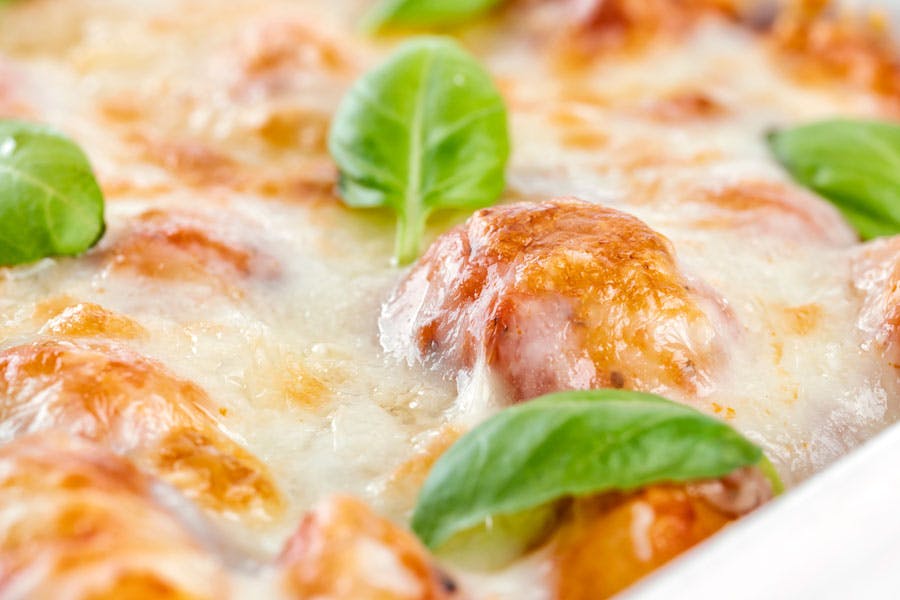 Gnocchi in a white pan.