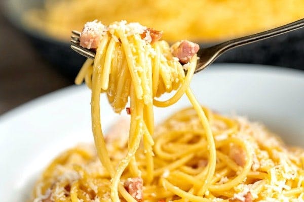 Classic Carbonara on a plate and a fork.