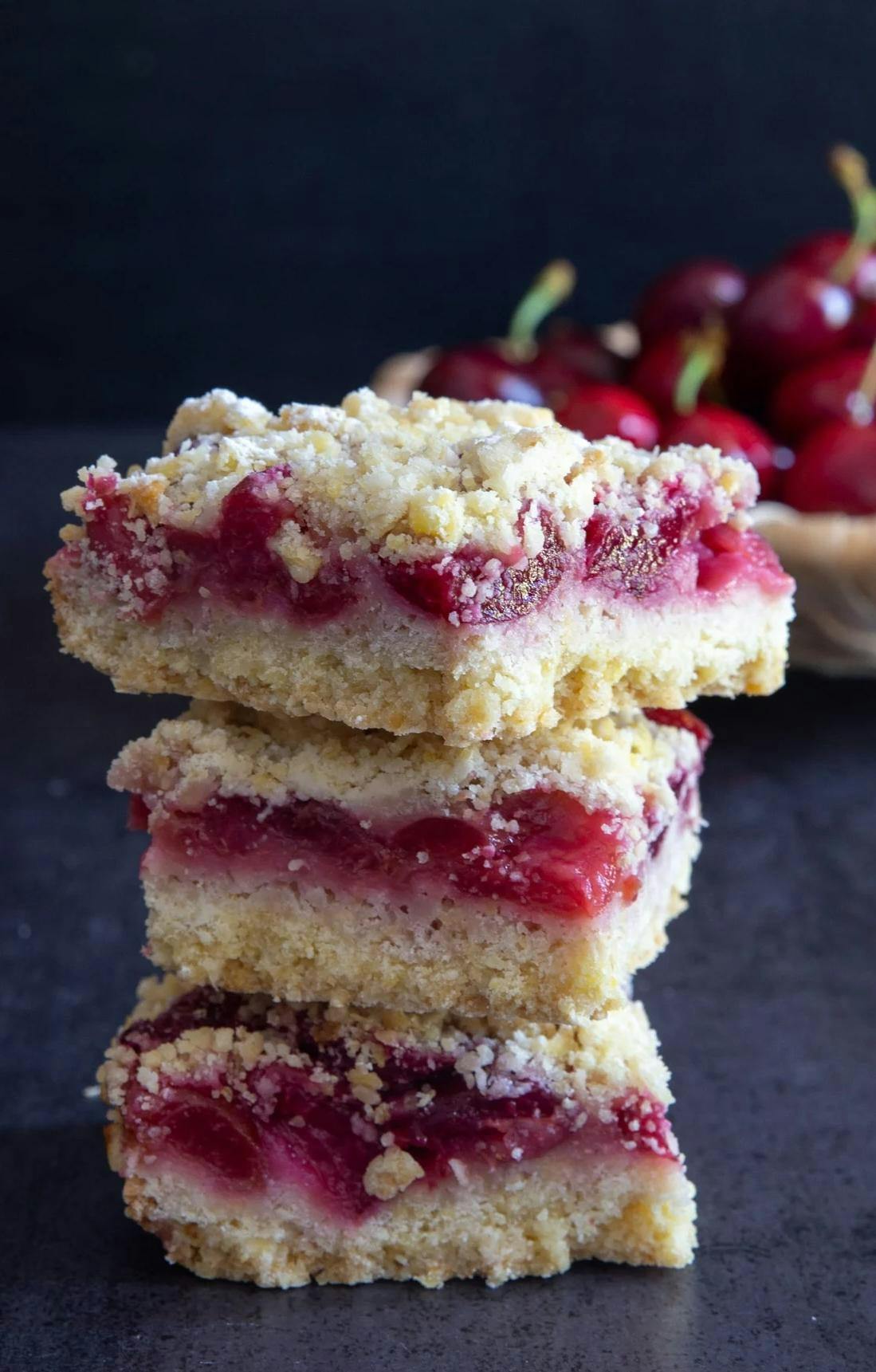 3 cherry crumb bars stacked.