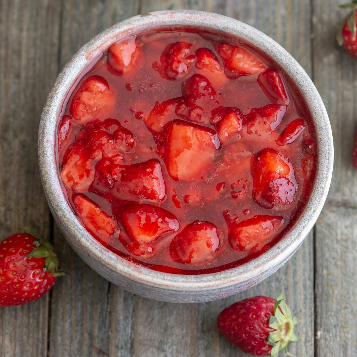 Strawberry sauce in a grey bowl.