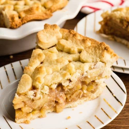A slice of apple pie on a plate.