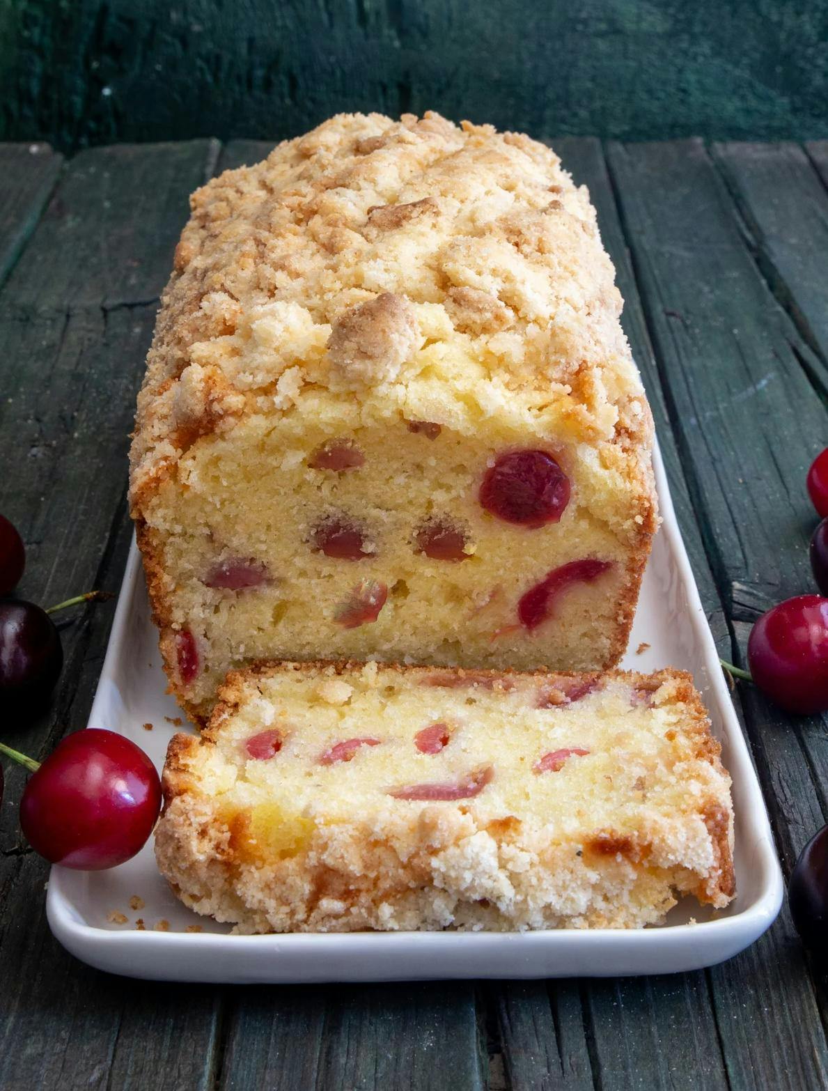 Cherry bread with 2 slices cut.