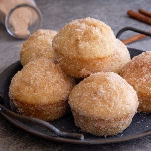 Donut muffins on a black plate.