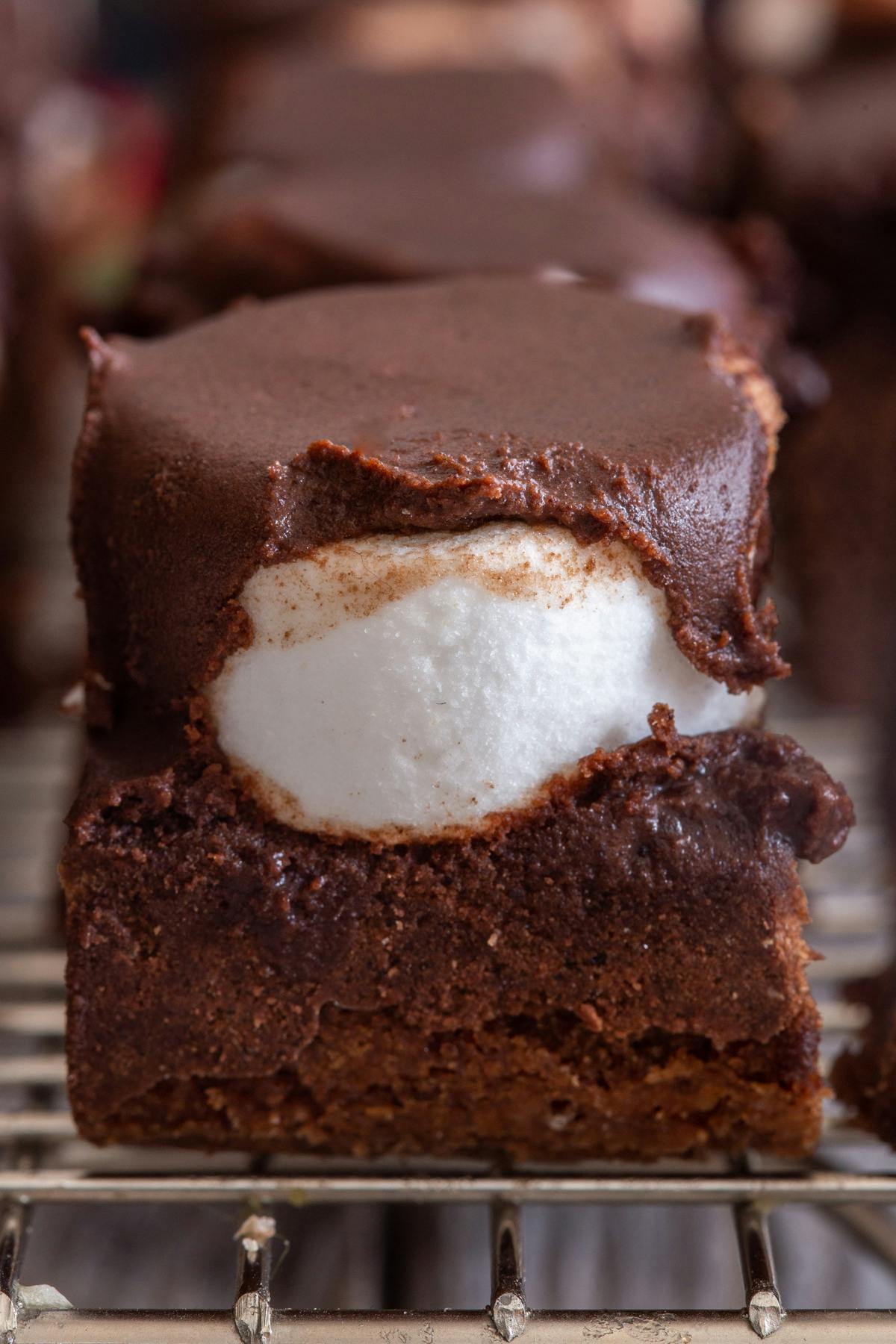 Fudgy brownie on a wire rack.