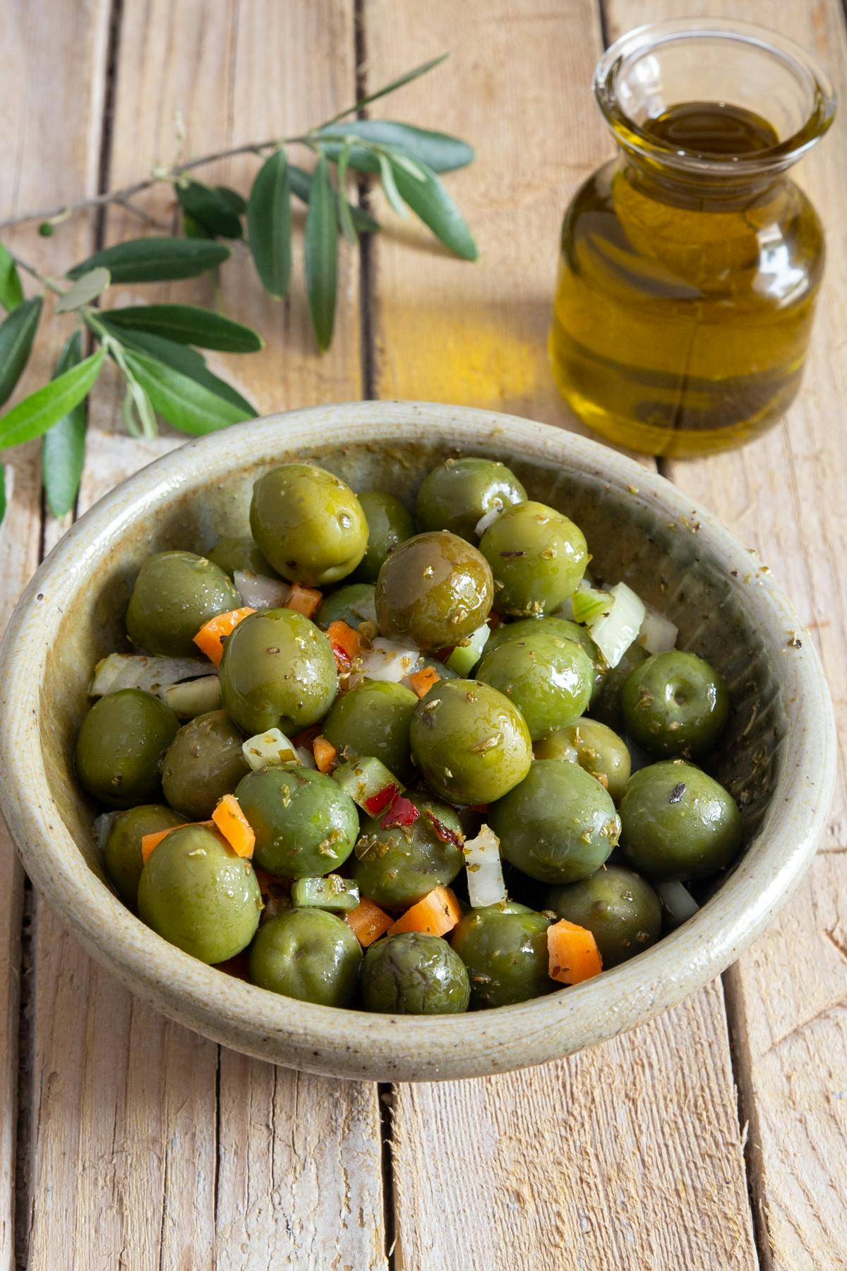 Italian olive salad in a grey bowl.