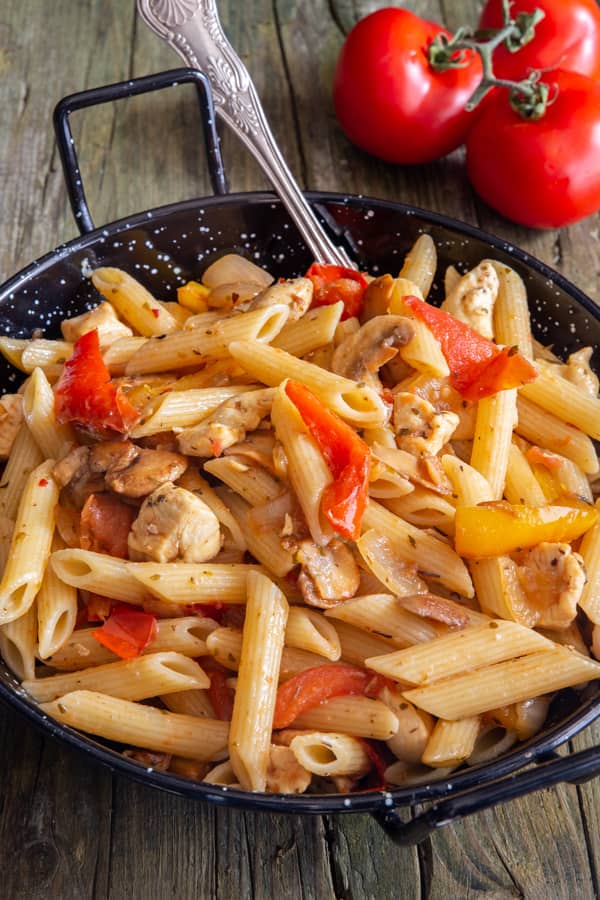 Turkey pasta in a black skillet.