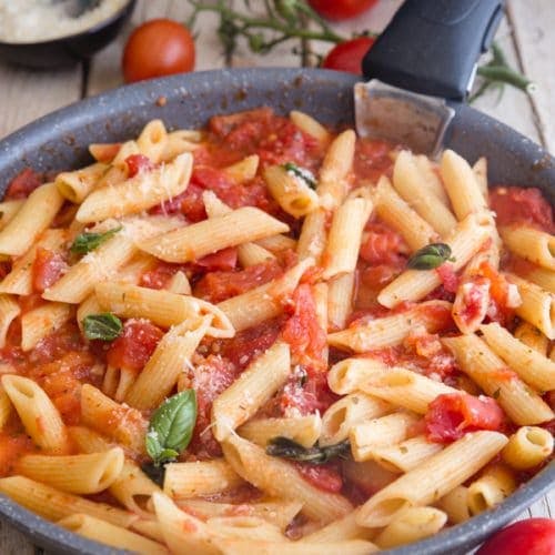 Fresh tomato sauce with pasta in a frying pan.