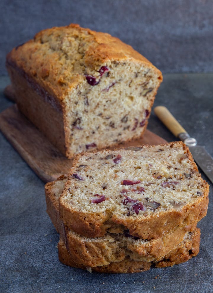 Walnut Cranberry bread with 2 slices cut.