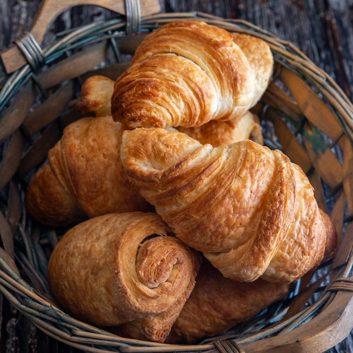 Croissant in a blue basket.