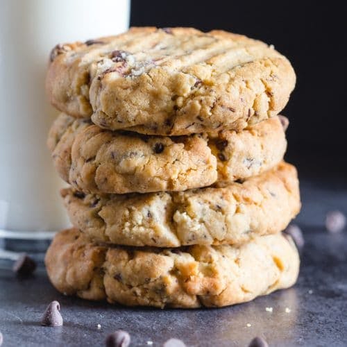 Cookies stacked on a black board.