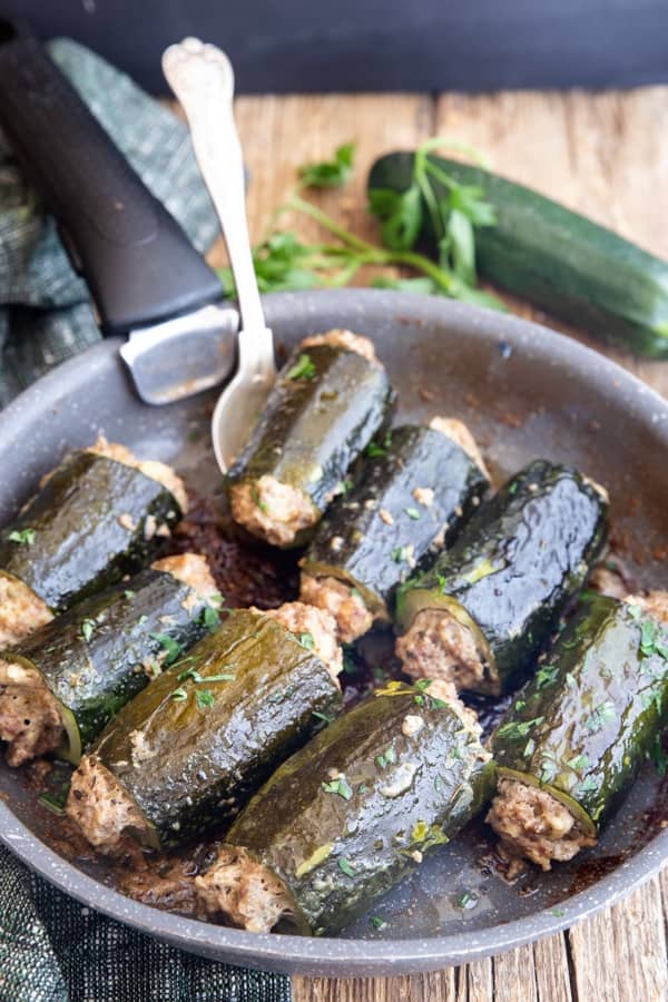 Stuffed zucchini in a pan.