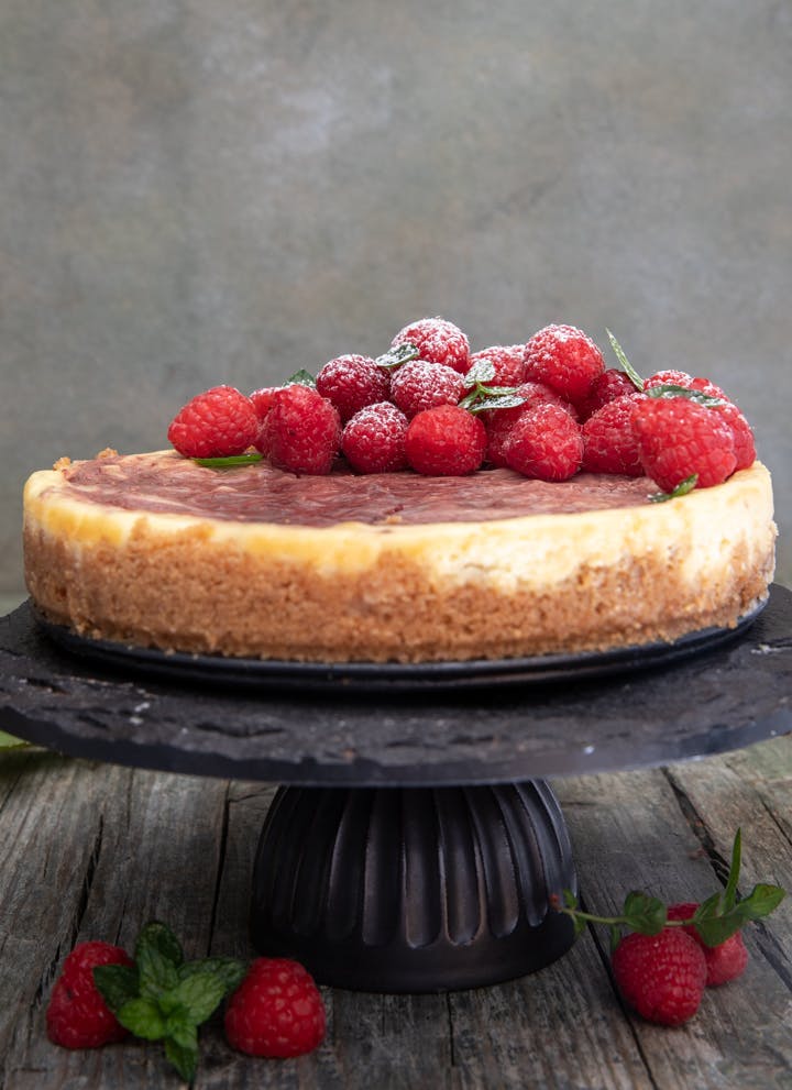 Easy Christmas Cheesecake on a black cake stand.