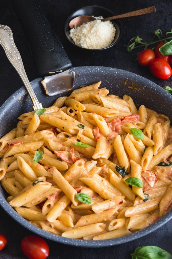 Creamy Tomato Pasta in a black pan.