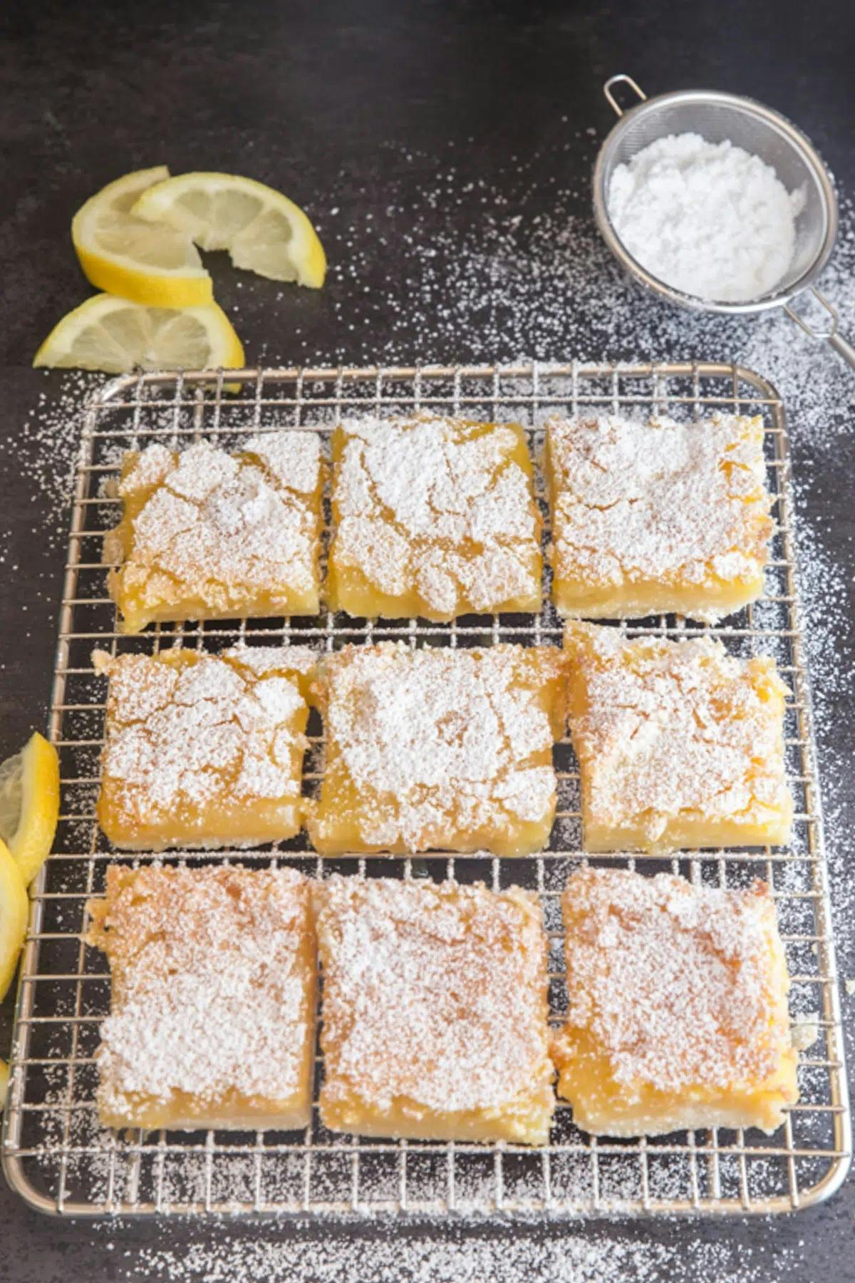 Lemon squares on a wire rack.