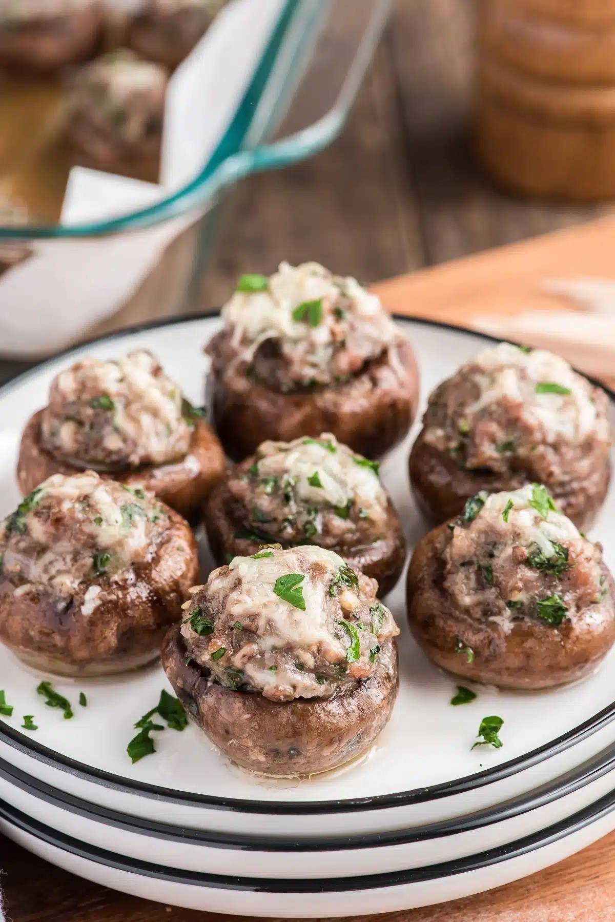 Italian stuffed mushrooms on a white plate.