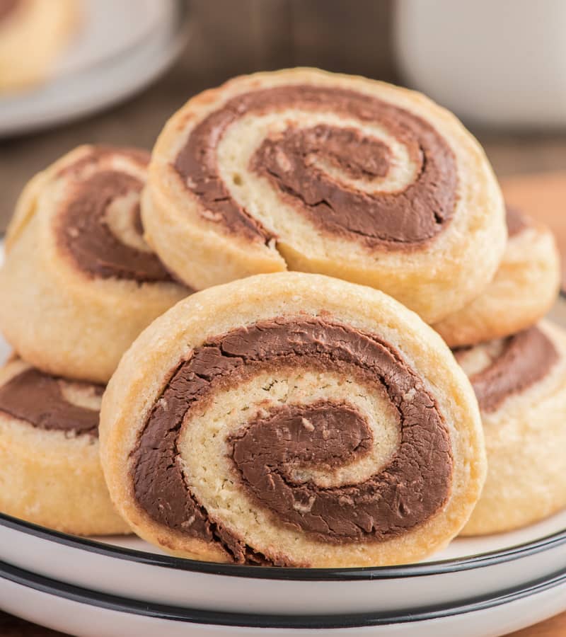 Nutella pinwheel cookies on a white plate.