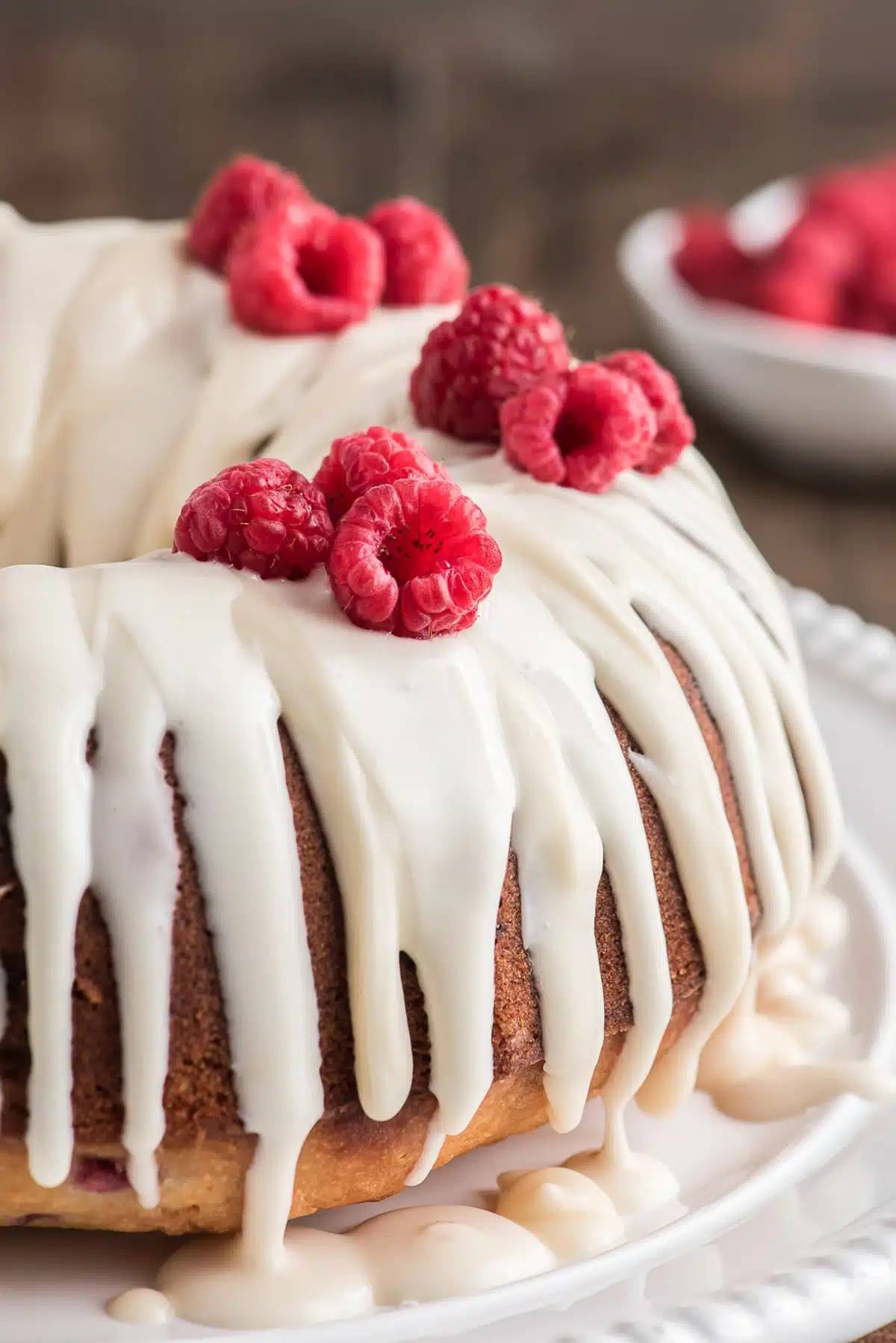 Raspberry bundt cake on a cake plate.