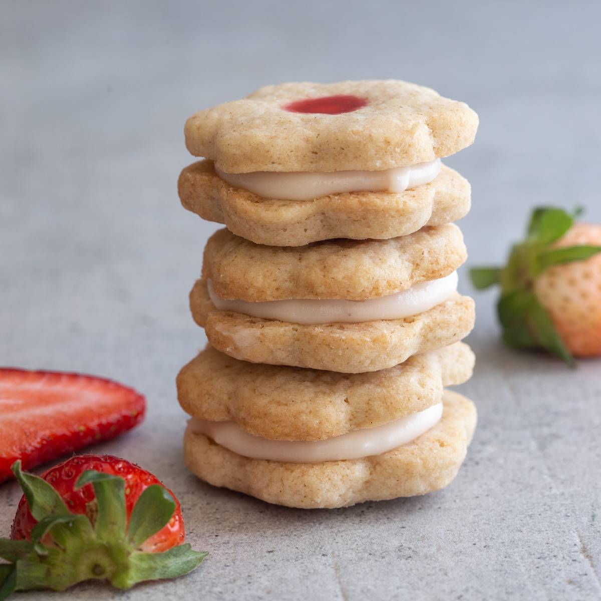 3 stacked strawberry sandwich cookies.