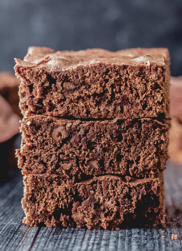 3 chocolate chip brownies stacked.
