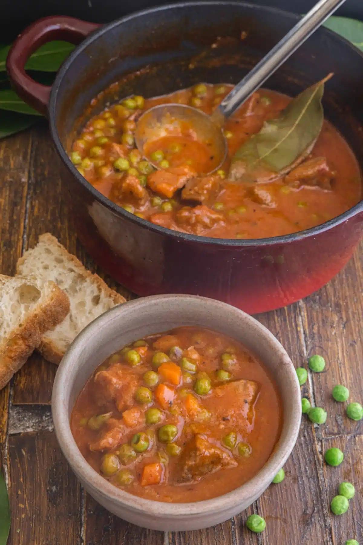 Italian beef stew in a pot and in a bowl.