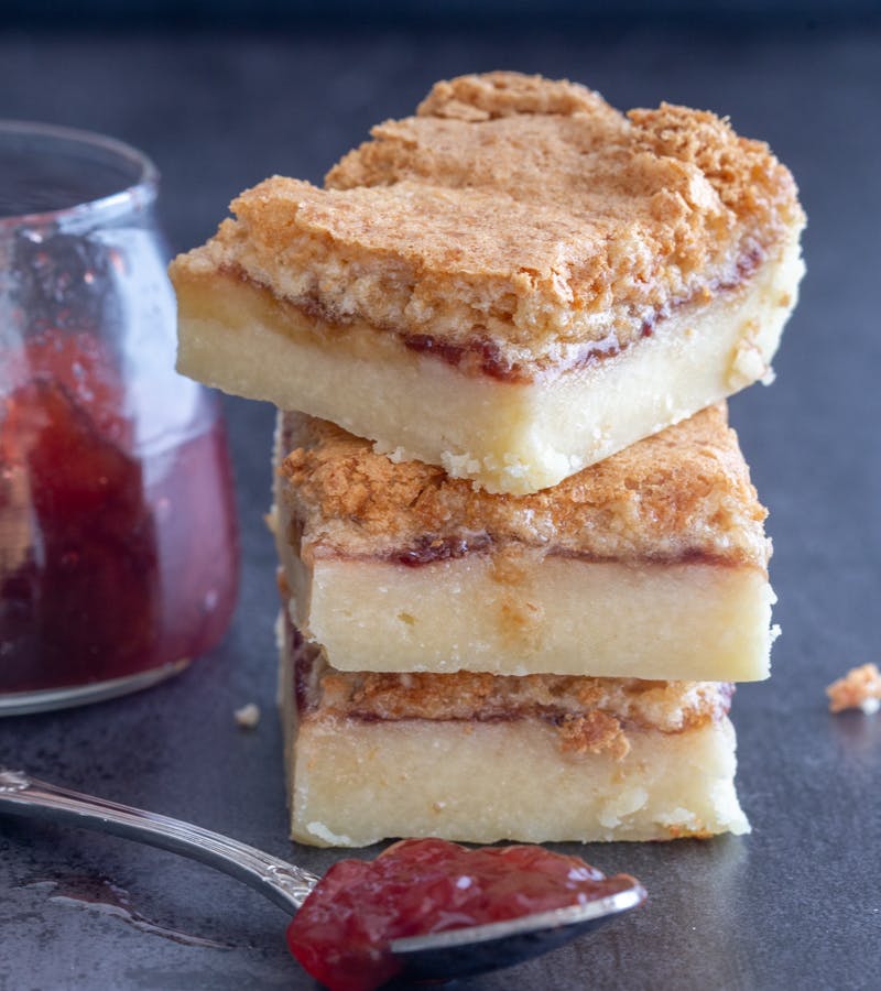 3 coconut jam cookies stacked.