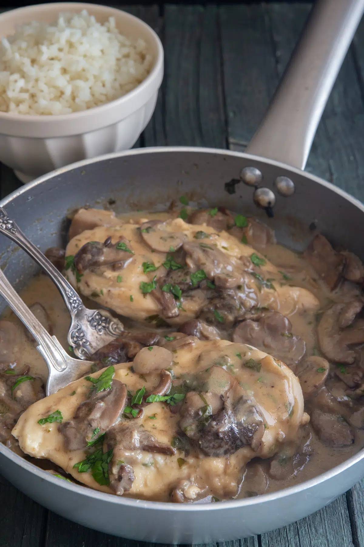 Chicken boscaiola in a silver pan.