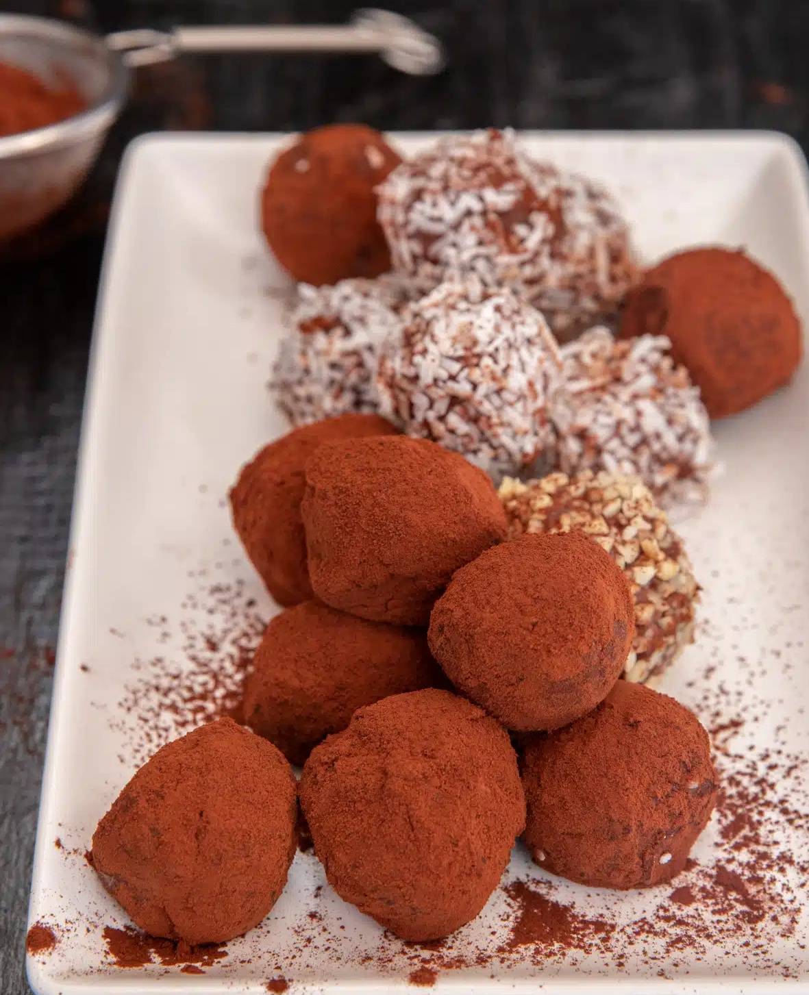 Baileys almond truffles on a white plate.