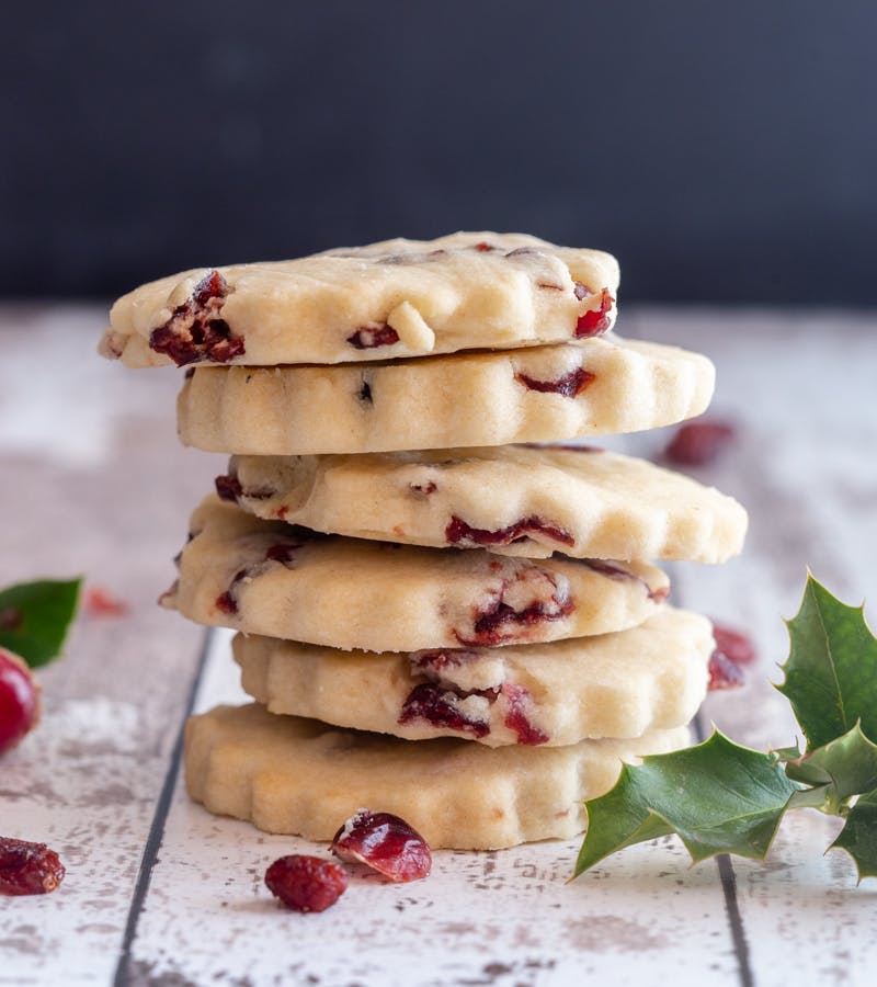 6 stacked cranberry shortbread cookies.