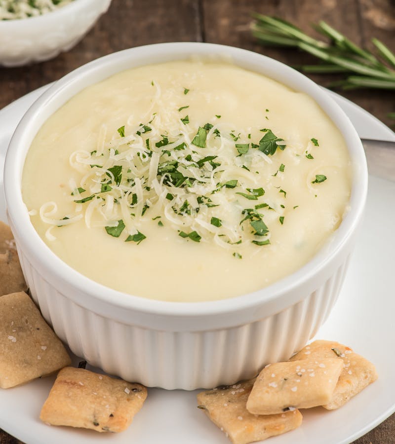 Creamy potato soup in a white bowl.