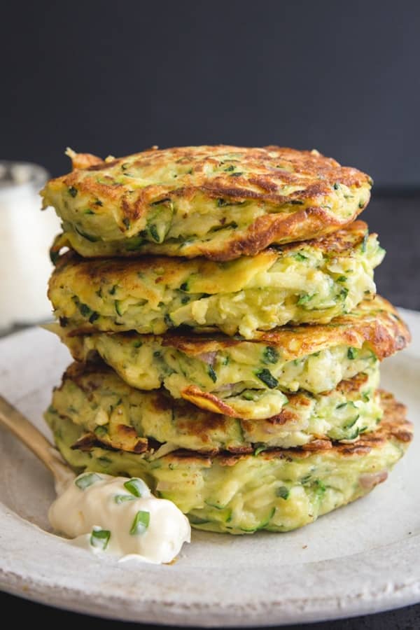 Zucchini patties stacked.