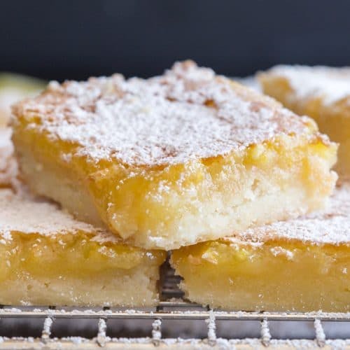 lemon bars on a wire rack.