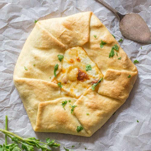 Savory pie on parchment paper.