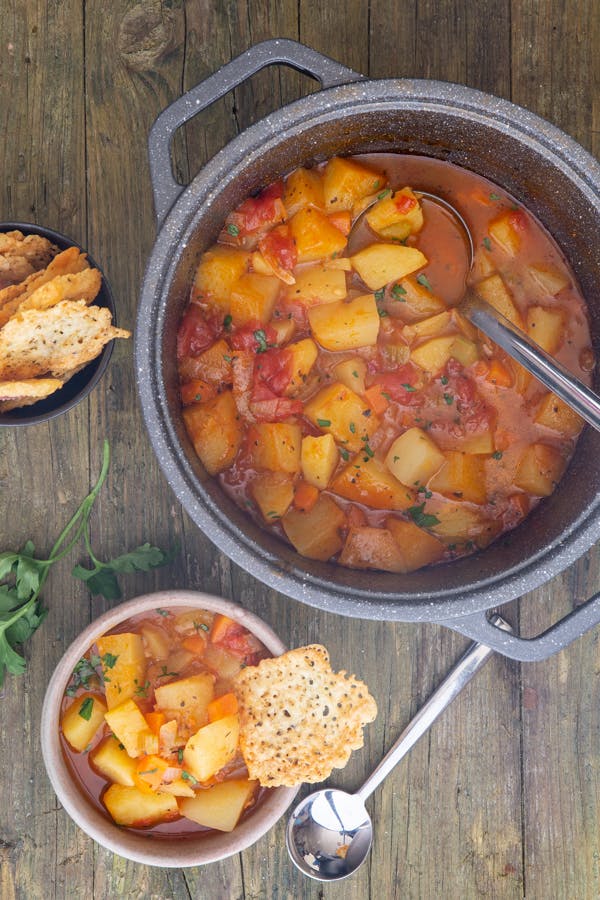 Italian Potato soup in a pot and in a bowl.